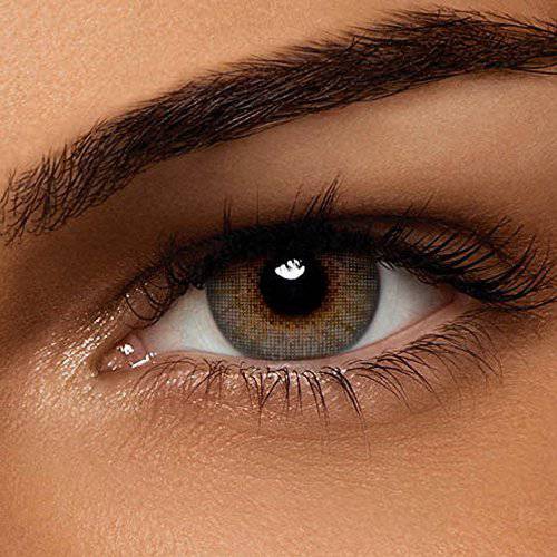 close photo of an eye with colored contact lense